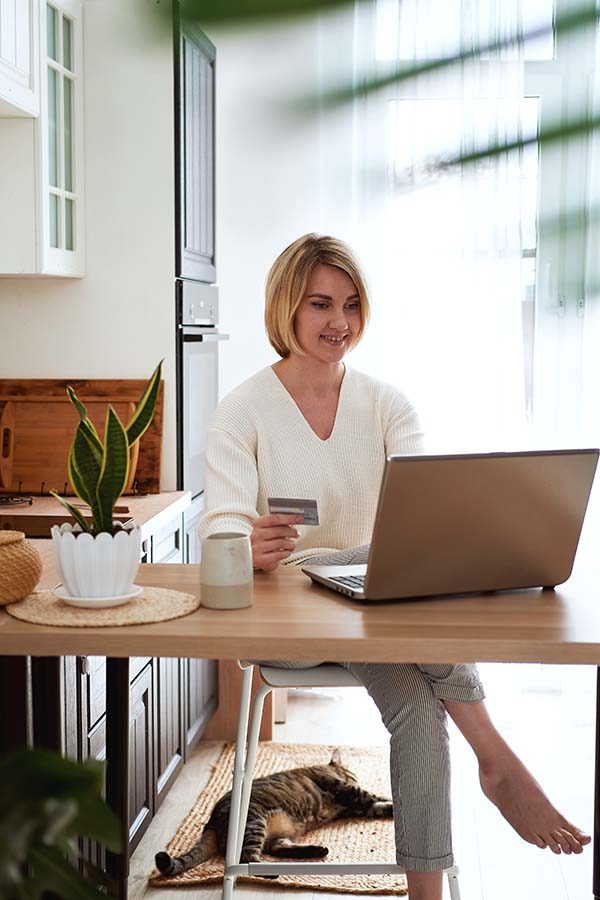 young-blonde-woman-buy-online-by-credit-card-on-th-73BRZRW.jpg